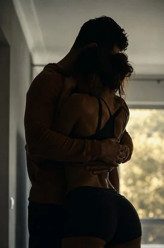 Couple enjoying an active, close moment at home