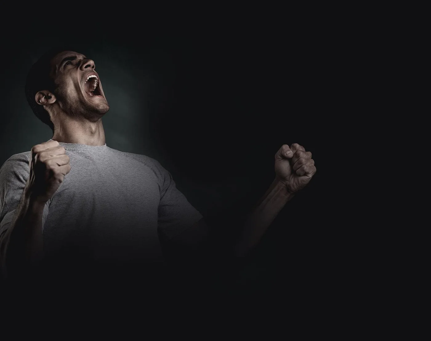 Man celebrating a personal win after reaching a wellness goal
